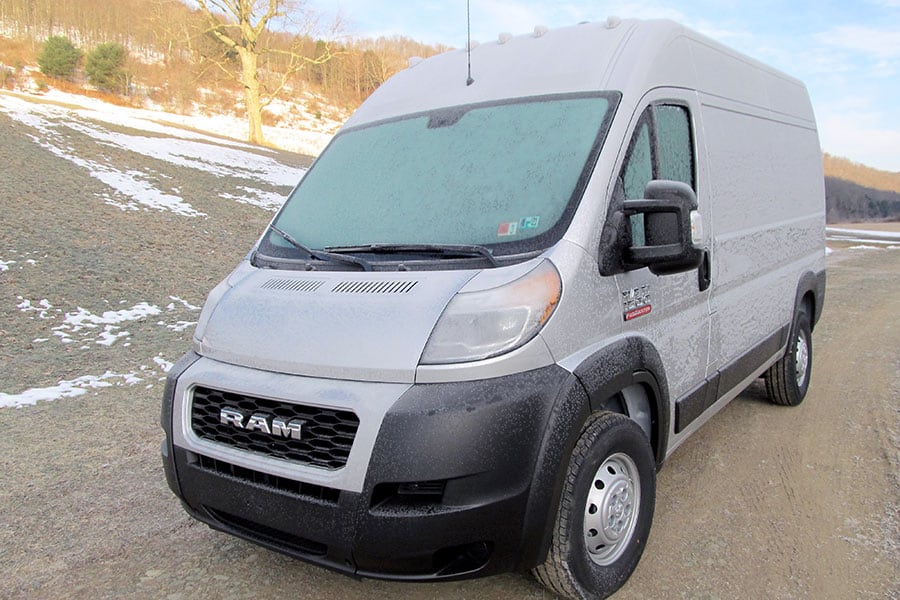 Gray cargo van with frost on exterior