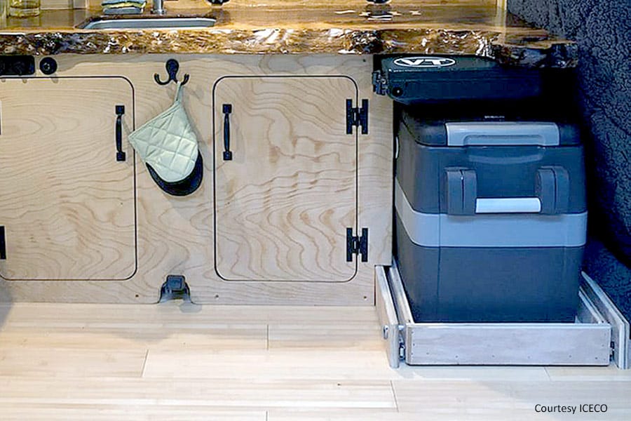 Portable refrigerator in camper van