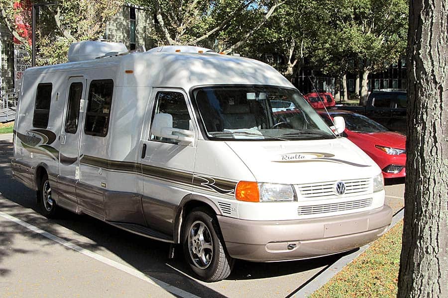 Cream and tan camper van parked in street