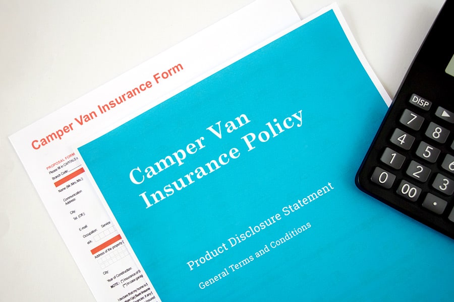 Insurance form and policy on desk