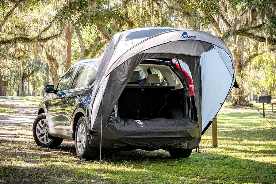Gray Napier tent over the open back of a SUV
