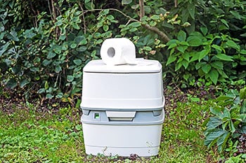 Portable toilet on grass