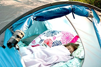 Girl sleeping in tent