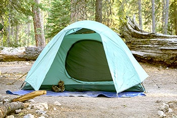 Green tent on a blue tarp