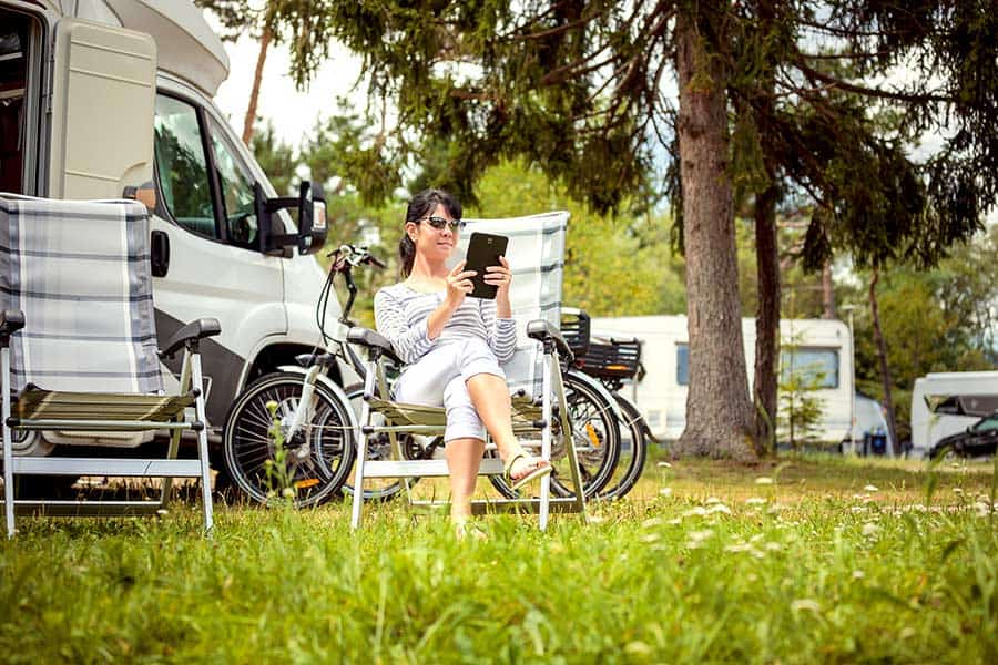 Woman sitting in chair at campground