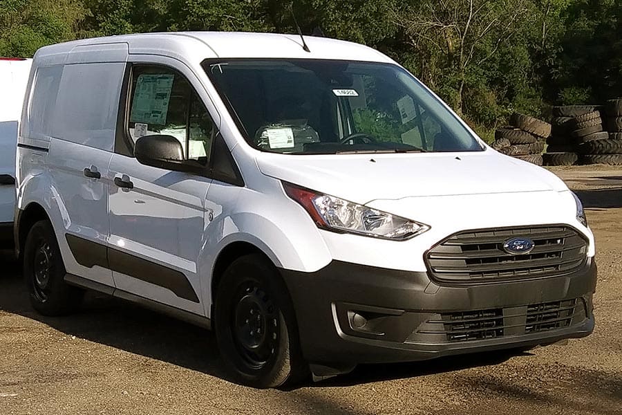 White Ford Transit Connect van in parking lot