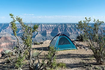 Tent on the edge of the Grand Canyon